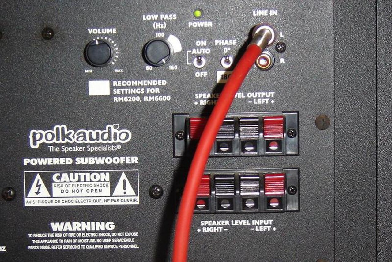 Rear panel of a subwoofer showing the control dials and connection sockets.